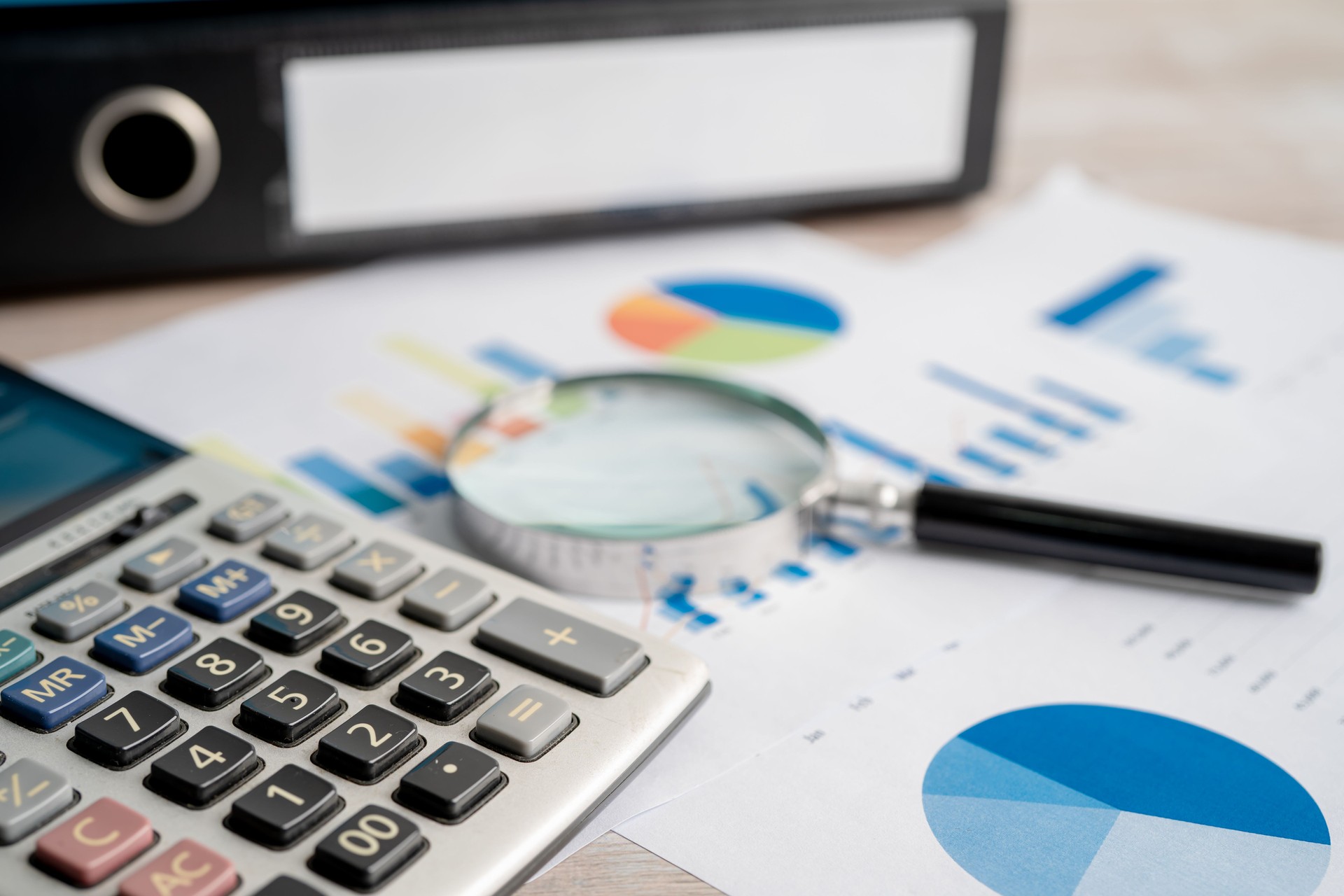 Binder data finance report business with graph analysis in office.